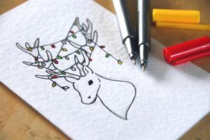 Tarjeta navidad dibujo a mano de un ciervo con lucecitas de navidad
